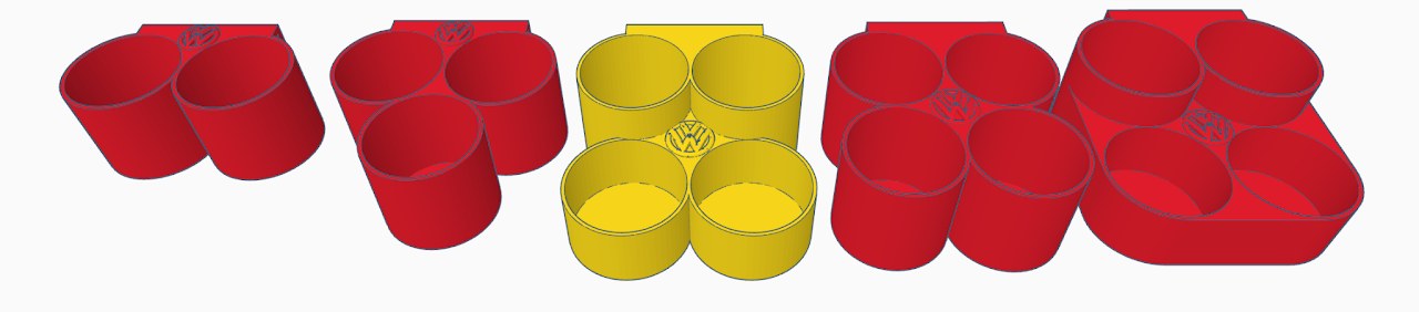 CAD renders of the rear-seat cupholder design variations