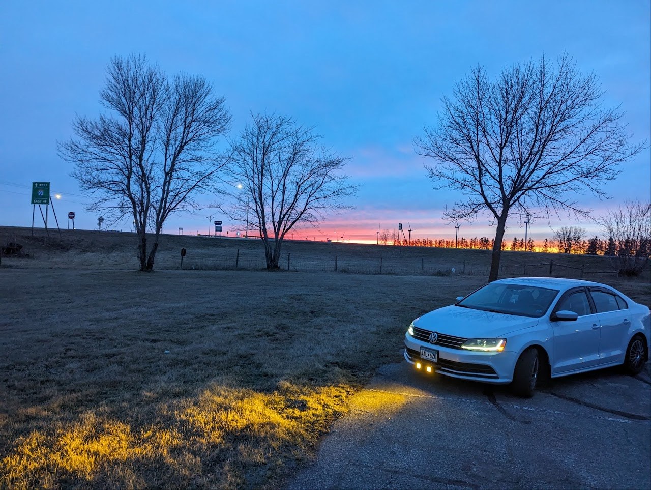 Jetta at dusk with the amber auxiliary off-road lights on